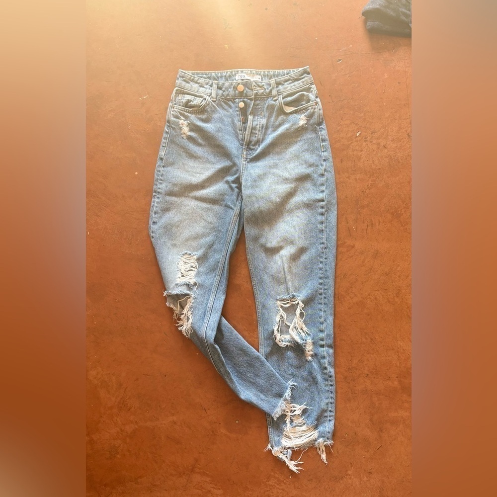 Women’s Zara distressed high rise jeans.